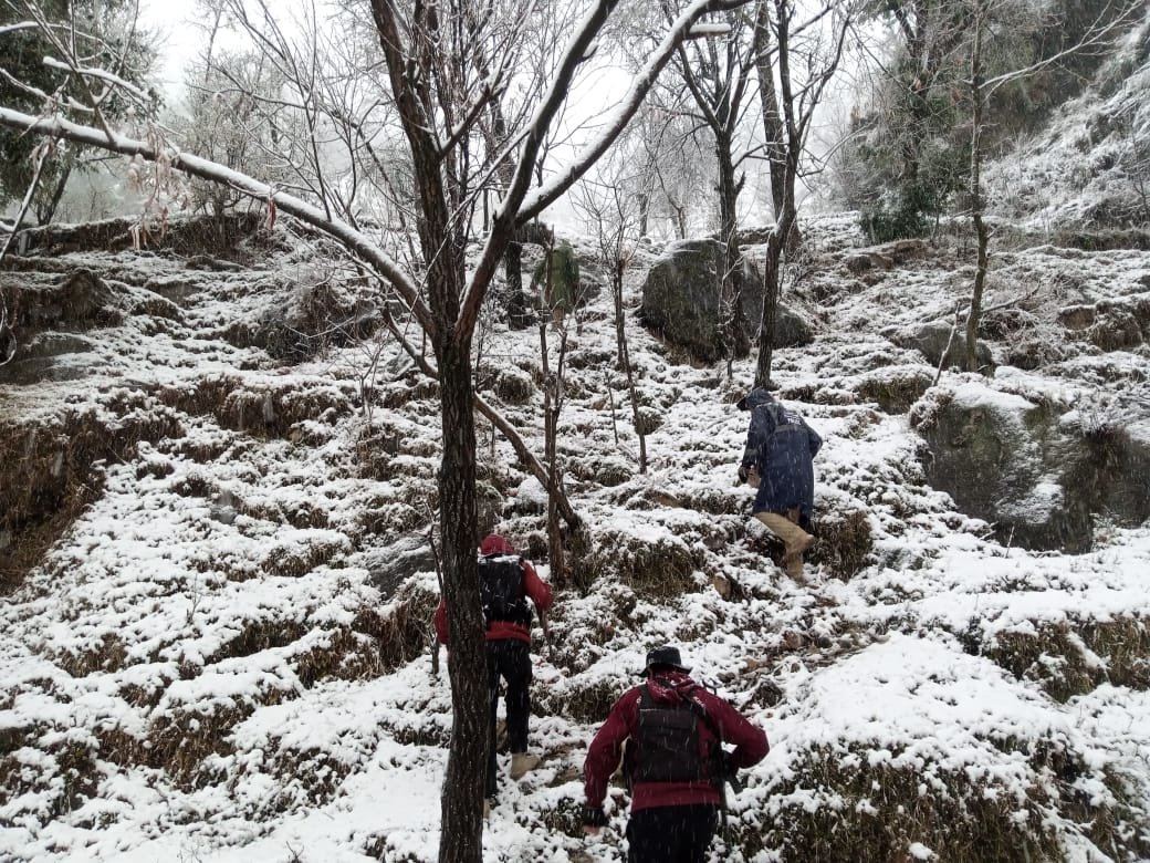 Police conduct search operation in snowy weather in Swat. 